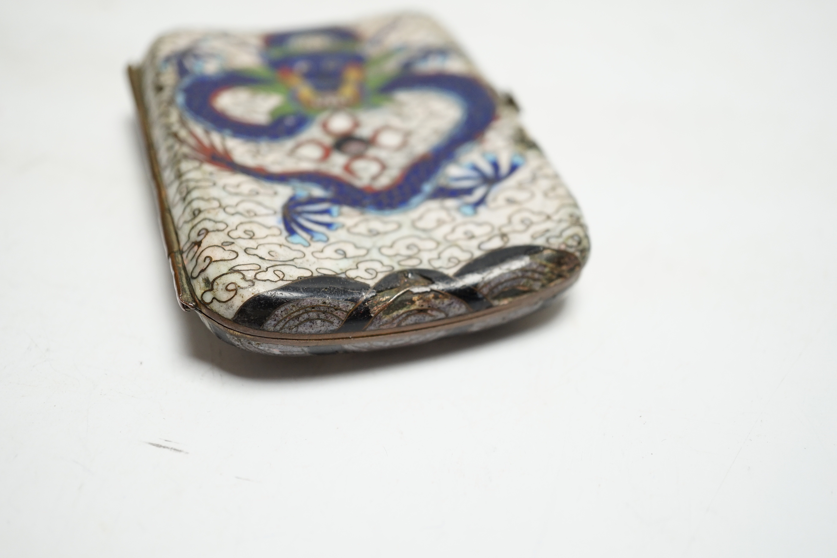 A Chinese cloisonné enamel ‘dragon’ design cigarette case, 9cm wide x 7cm deep